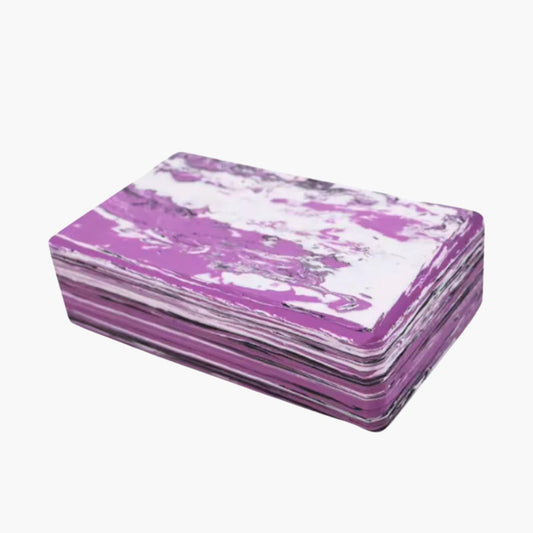 A lightweight and durable yoga block named "Camouflage," featuring a unique purple and white marble pattern. Made from high-density EVA foam, this block provides firm support for various yoga poses, balance exercises, and stretching routines. Designed to enhance stability, alignment, and flexibility, it is ideal for practitioners of all levels, from beginners to advanced yogis.