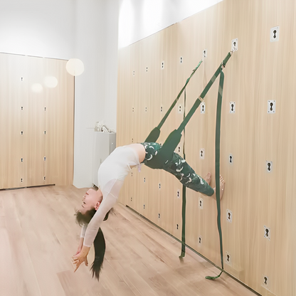 A yoga practitioner performing an advanced backbend using the Iyengar Yoga Wall Rope system. The sturdy wall-mounted straps provide support and stability, allowing for deep stretches, spinal decompression, and improved flexibility. Ideal for alignment-focused yoga and inversion therapy.