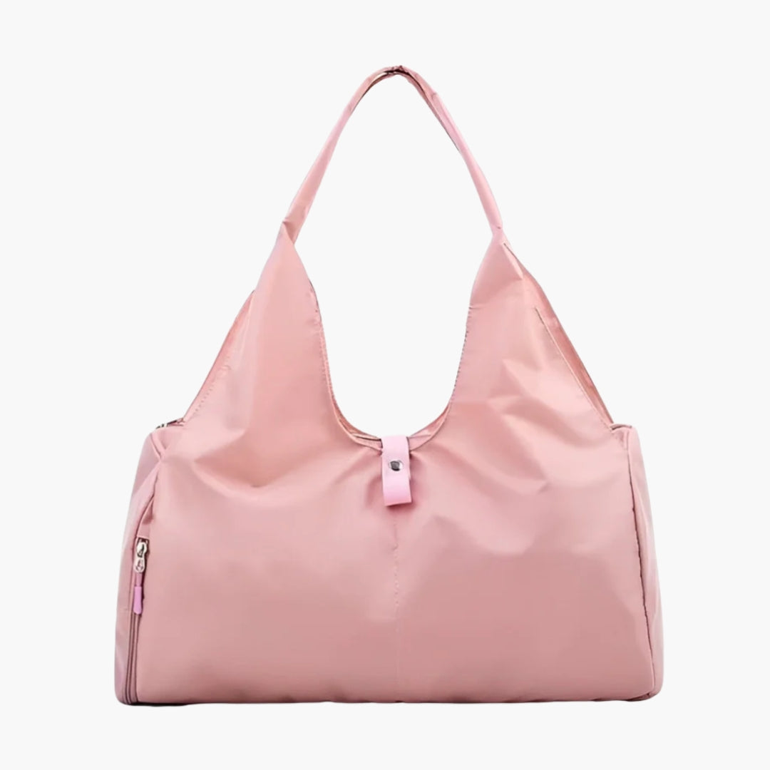The Move Ease Gym and Yoga Bag is a stylish and functional carry-all designed for active individuals. Crafted from high-quality, water-resistant nylon, this lightweight bag provides ample space for a yoga mat, gym clothes, shoes, water bottle, and personal essentials. It features a spacious main compartment, secure internal pockets for valuables, and a dedicated side pocket for organizing smaller items.