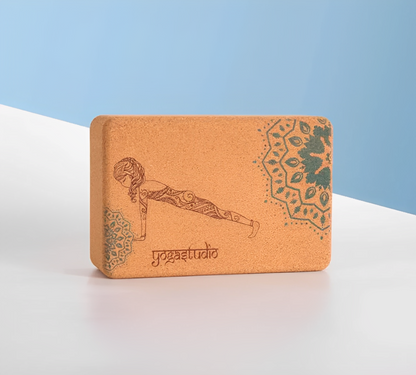 Image of the Core Block, a yoga accessory set featuring two natural cork blocks with intricate designs and the phrase 'Just Practice On.' The blocks, crafted from eco-friendly small-grain cork, are paired with a yoga strap, providing tools for stability, alignment, and flexibility. Ideal for enhancing yoga practice while promoting sustainability.