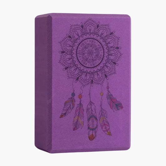 The ZenBlock Yoga Block is a high-density EVA foam block designed for balance, flexibility, and support in yoga and Pilates. Featuring a unique dreamcatcher mandala engraving, it provides a non-slip surface for enhanced grip. Lightweight yet durable, this block is perfect for assisting in deep stretches, improving posture, and maintaining stability during challenging poses. Ideal for beginners and advanced practitioners alike.