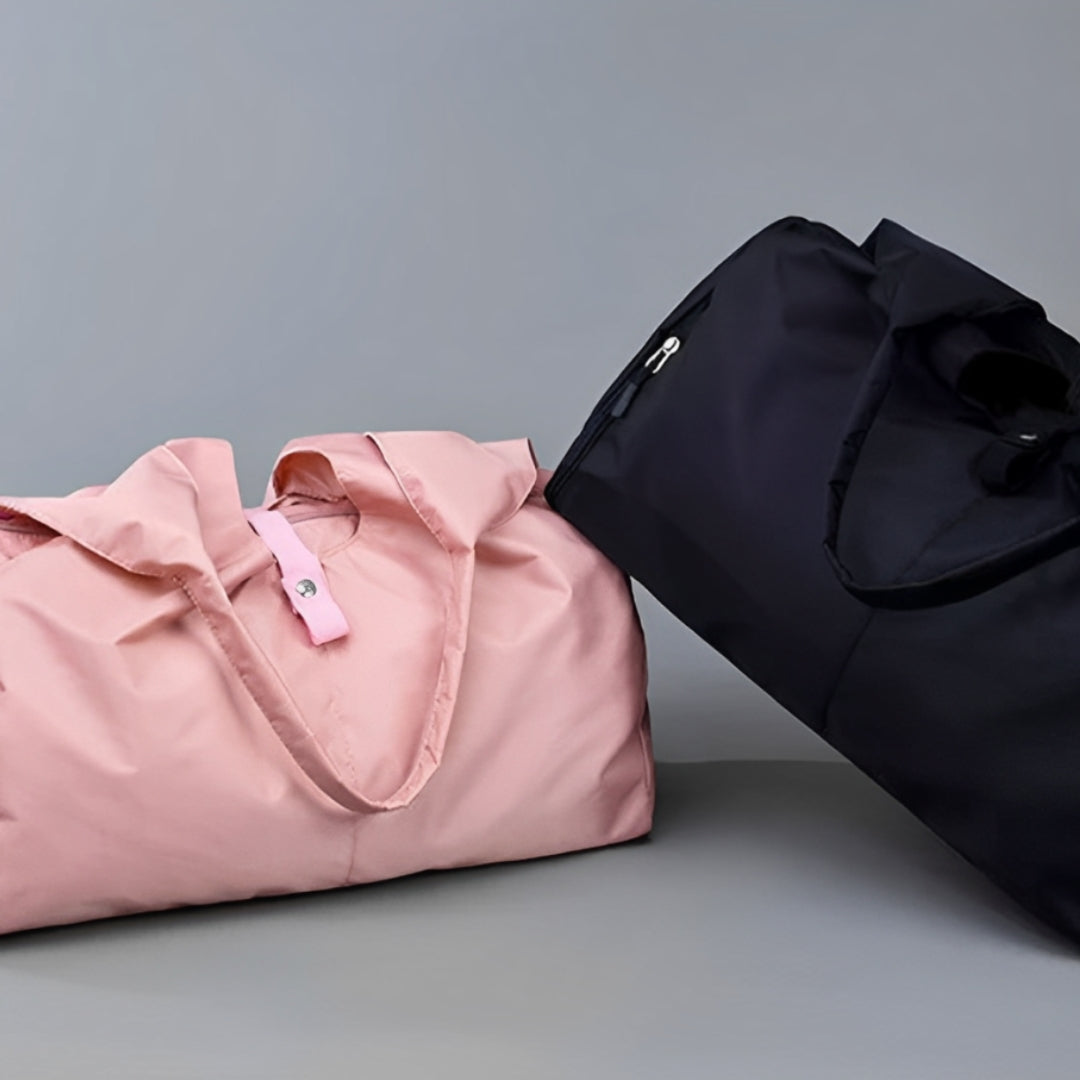 Image of the Move Ease Yoga Mat Bag available in pink and black colors. These durable nylon bags feature a spacious interior for carrying yoga mats, workout gear, and personal essentials. With a minimalist and unisex design, they include comfortable carrying options through handles or an adjustable shoulder strap, making them ideal for fitness enthusiasts on the go.