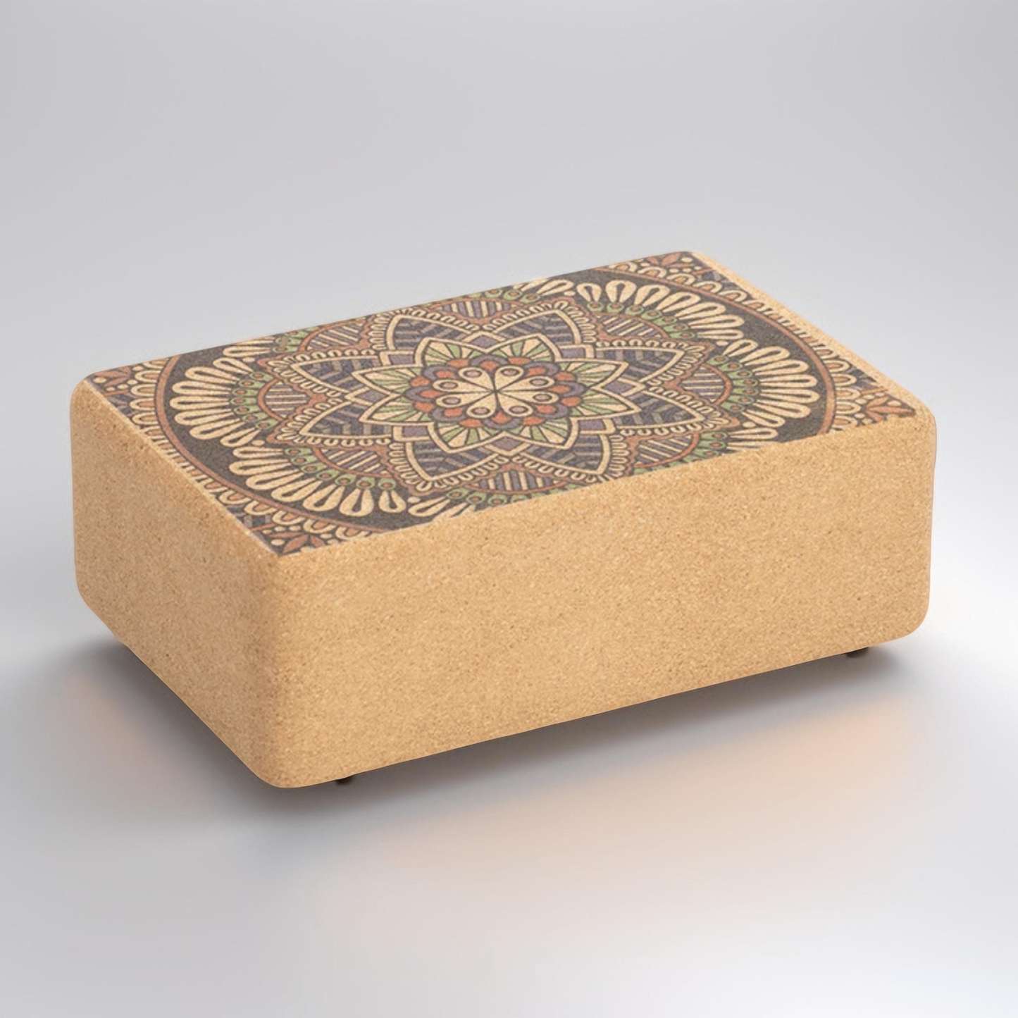 Image of a Yoga Cork Block with a beautifully engraved mandala design on the surface. Made from eco-friendly cork, this sturdy block provides stability and support for yoga poses, aiding in alignment and flexibility. Its intricate design adds a touch of elegance to functional fitness.