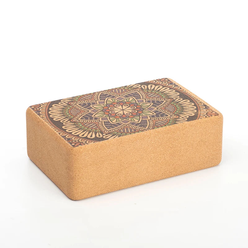 Image of a Yoga Cork Block with a beautifully engraved mandala design on the surface. Made from eco-friendly cork, this sturdy block provides stability and support for yoga poses, aiding in alignment and flexibility. Its intricate design adds a touch of elegance to functional fitness.