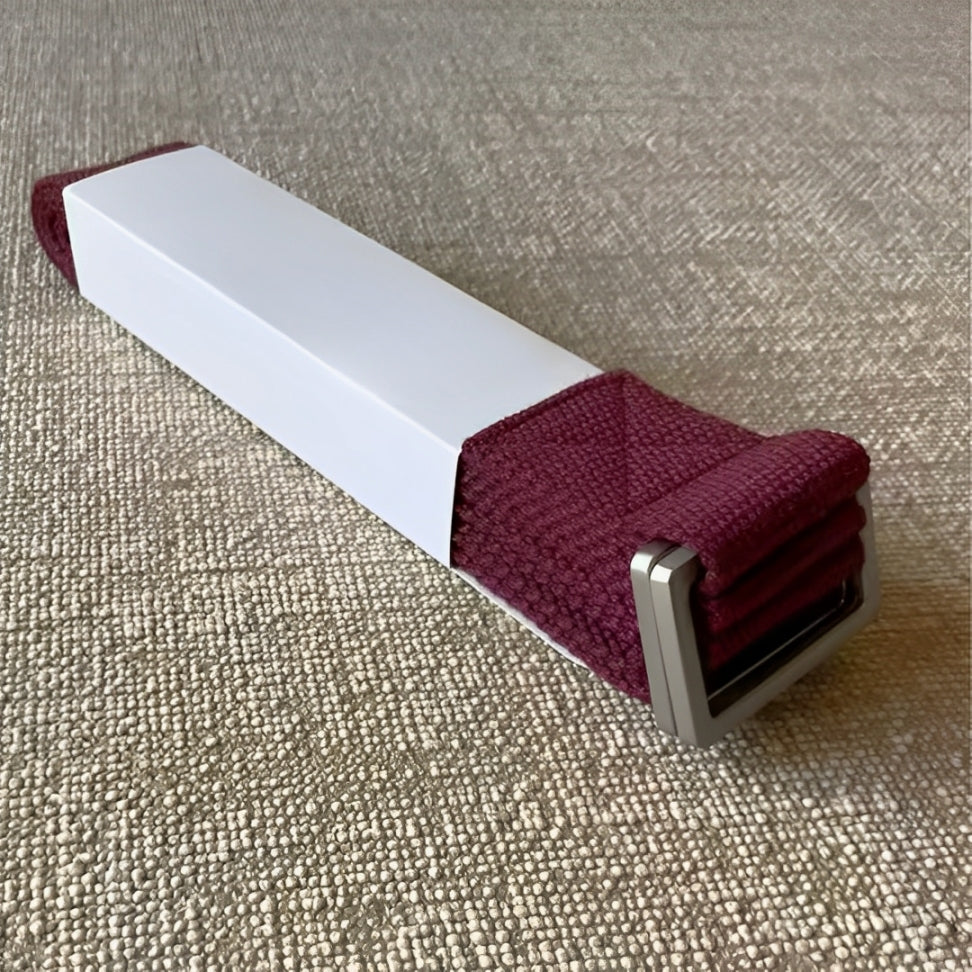 The FlexCore yoga strap in a rich deep burgundy shade, featuring a strong metal buckle for secure adjustments. Made from eco-friendly cotton, this durable and stylish strap supports flexibility, deep stretches, and stability in yoga practice.