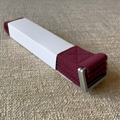 The FlexCore yoga strap in a rich deep burgundy shade, featuring a strong metal buckle for secure adjustments. Made from eco-friendly cotton, this durable and stylish strap supports flexibility, deep stretches, and stability in yoga practice.