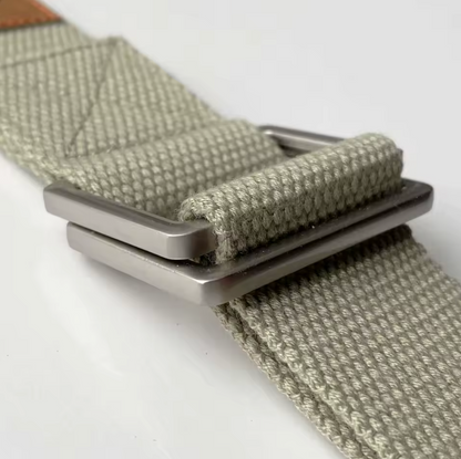 A close-up view of the FlexCore yoga strap's durable metal buckle, highlighting its sturdy double-loop design for secure adjustments. The tightly woven cotton strap in sage green ensures strength and comfort, making it ideal for deep stretches, alignment, and posture support in yoga practice.