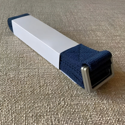 The FlexCore yoga strap in an elegant navy blue color, featuring a sturdy metal buckle for secure adjustments. Made from durable, eco-friendly cotton, it provides stability, flexibility, and support for deep stretches and yoga practice.