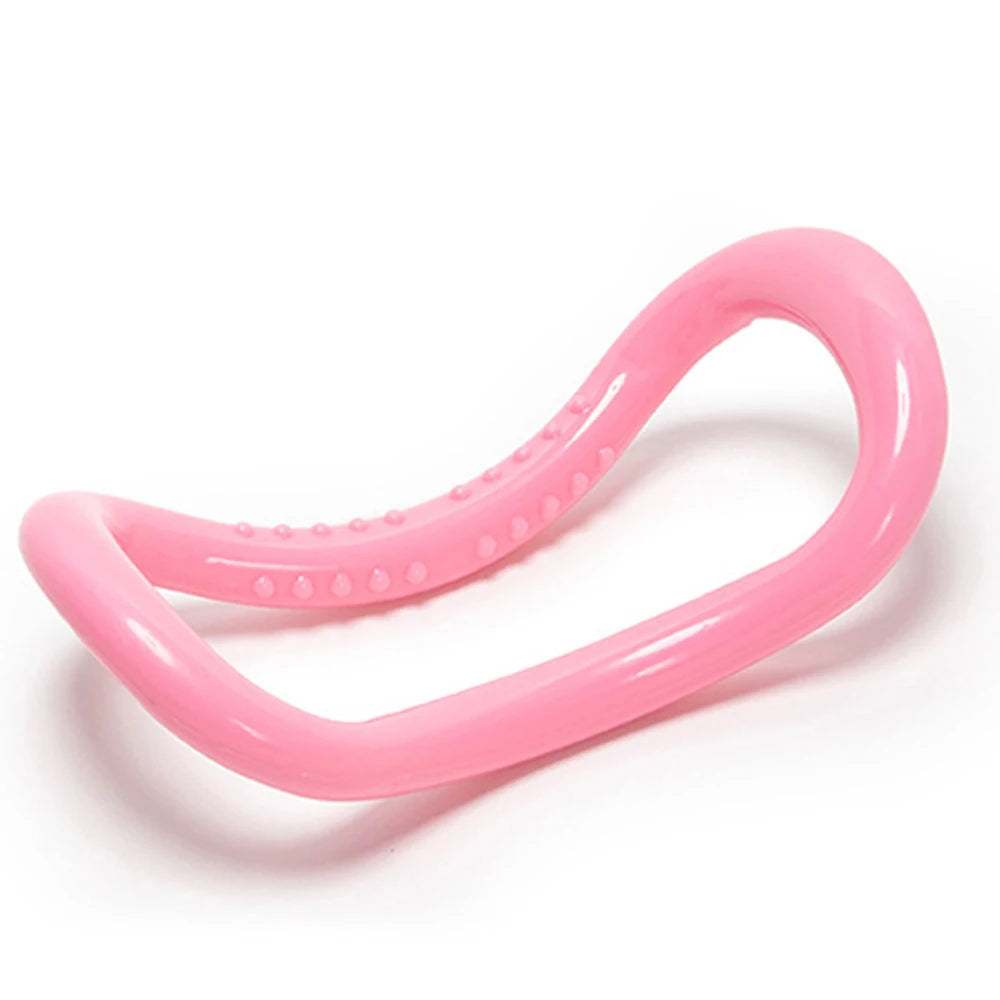 Image of the FlexiCurve Ring in a bright pink color, featuring an ergonomic double-curve design with textured details for grip and massage. The compact, lightweight tool is ideal for yoga, Pilates, muscle stretching, and relaxation, made from eco-friendly recyclable PP material for durability and long-term use.