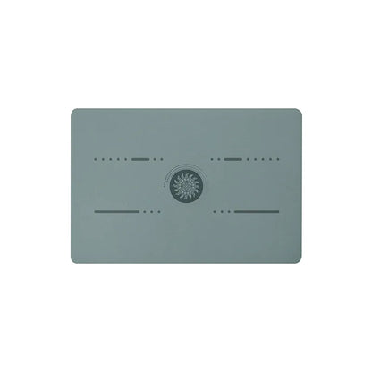 Image of the FlexPad, a rectangular yoga pad in gray, designed for targeted support and comfort during yoga or fitness exercises. The pad features a central patterned design and subtle grooves, made from eco-friendly PU natural rubber. Compact and lightweight, it provides stability and cushioning for knees, head, or other sensitive areas.