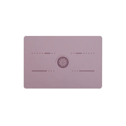 Image of the FlexPad, a rectangular yoga pad in purple, designed for targeted support and comfort during yoga or fitness exercises. The pad features a central patterned design and subtle grooves, made from eco-friendly PU natural rubber. Compact and lightweight, it provides stability and cushioning for knees, head, or other sensitive areas.