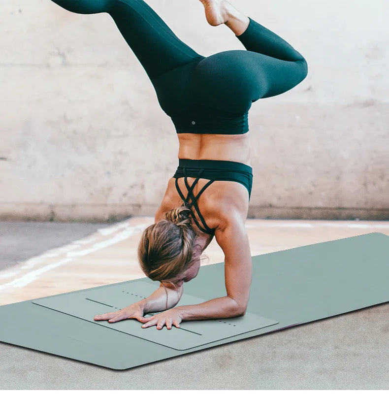 Image of the FlexPad, a rectangular yoga pad in gray, designed for targeted support and comfort during yoga or fitness exercises. The pad features a central patterned design and subtle grooves, made from eco-friendly PU natural rubber. Compact and lightweight, it provides stability and cushioning for knees, head, or other sensitive areas.