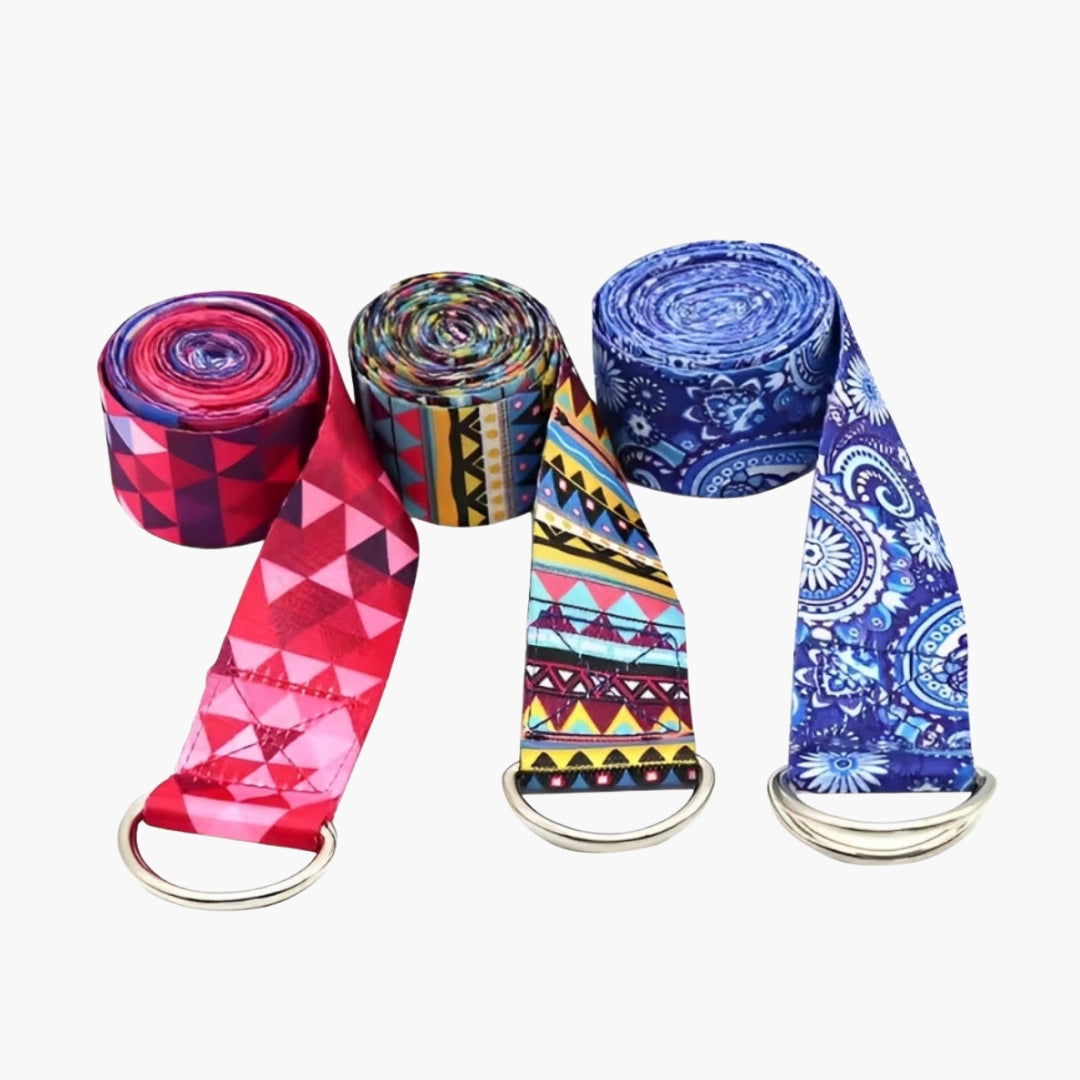 The Plentyoga StretchFlow Yoga Strap Set features three beautifully patterned yoga straps, each designed to enhance flexibility, deepen stretches, and support posture alignment. Made from a durable cotton blend, these straps offer a secure grip with sturdy D-ring buckles for easy adjustments. The set includes three vibrant designs: a red geometric pattern, a multicolored tribal print, and a blue mandala motif, adding style to your yoga practice.