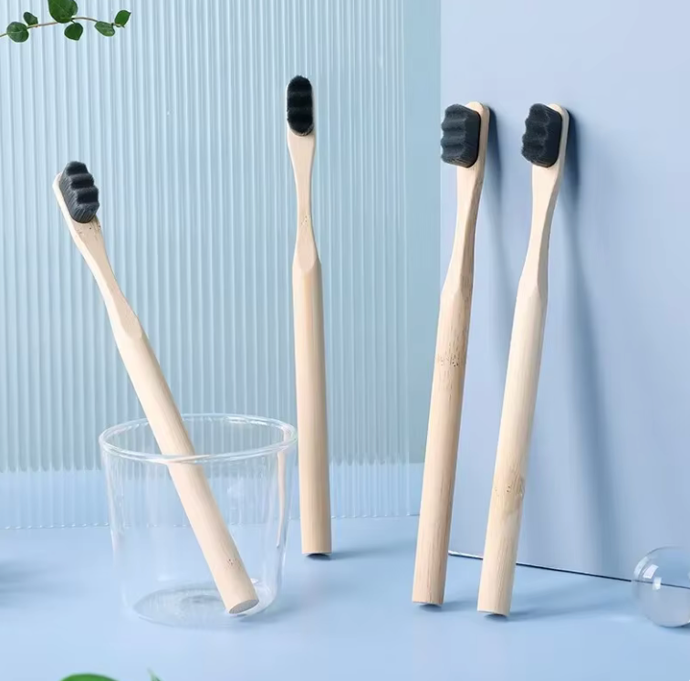 Image of PureEarth toothbrushes featuring natural bamboo handles and black bristles. These eco-friendly toothbrushes are designed to reduce plastic waste while providing a deep and effective clean. Displayed in a minimalist setting, they are perfect for those seeking a sustainable oral care solution.