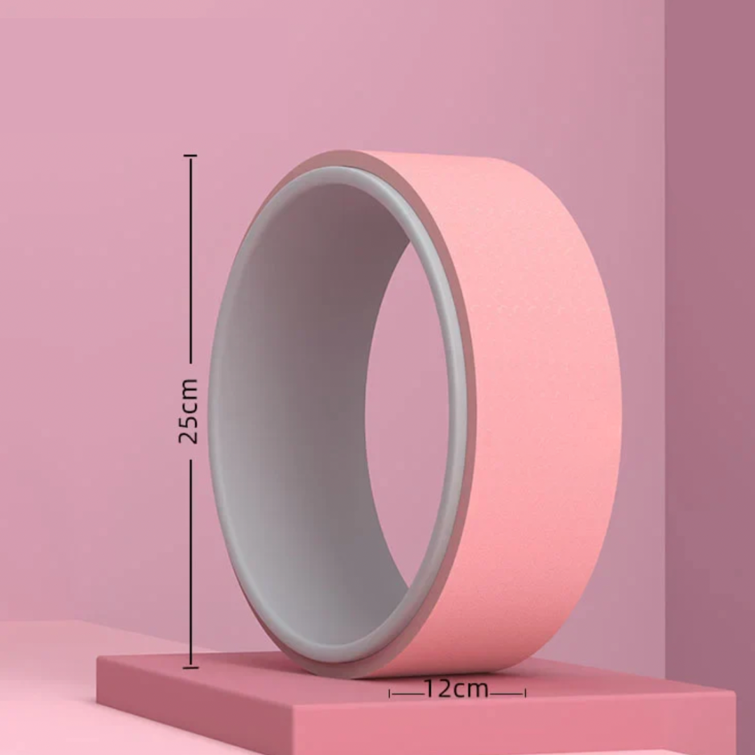 Image of the Soul Flex Wheel, a pink and gray TPE yoga wheel, designed for stretching, improving flexibility, and muscle massage. Shown in use, it supports deep backbends and provides stability during yoga poses. Crafted with durable and anti-slip materials, it offers comfort and safety for yogis of all levels.