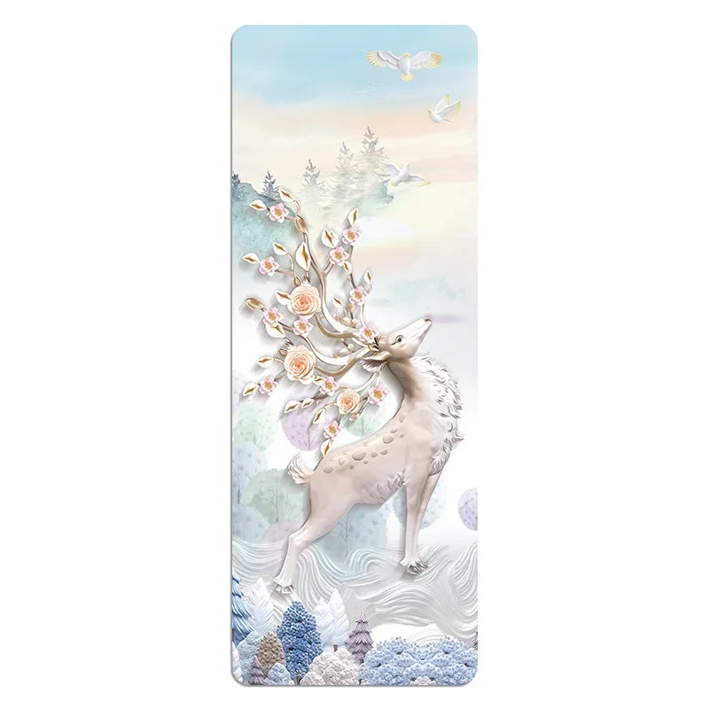 Image of the Travel Ease Yoga Mat in the 'Lightblue' design, featuring an elegant illustration of a deer surrounded by floral and nature-inspired elements in soft pastel tones. Crafted from a suede and rubber blend, this ultra-thin, foldable mat combines functionality with a serene artistic aesthetic, ideal for yoga and fitness routines.