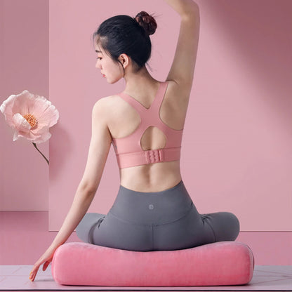 Image of the Prana Cushion, available in soft pink and gray colors. This eco-friendly yoga bolster features a sleek, rectangular design, made from mixed-density recycled foam layers for superior support and comfort. Perfect for meditation and yoga, it includes a machine-washable cover with a hidden zipper for easy maintenance.