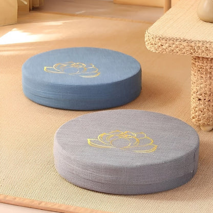 Image of the ZenBase Meditation Cushions in gray, brown, and red, each featuring a minimalist lotus design. These durable cushions provide firm support for meditation and yoga, combining Japanese-inspired tatami aesthetics with practicality. Compact, washable, and perfect for enhancing mindfulness practices.