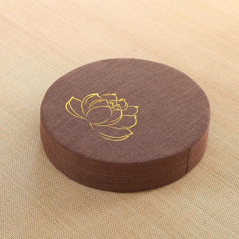 Image of the ZenBase Meditation Cushions in gray, brown, and red, each featuring a minimalist lotus design. These durable cushions provide firm support for meditation and yoga, combining Japanese-inspired tatami aesthetics with practicality. Compact, washable, and perfect for enhancing mindfulness practices.