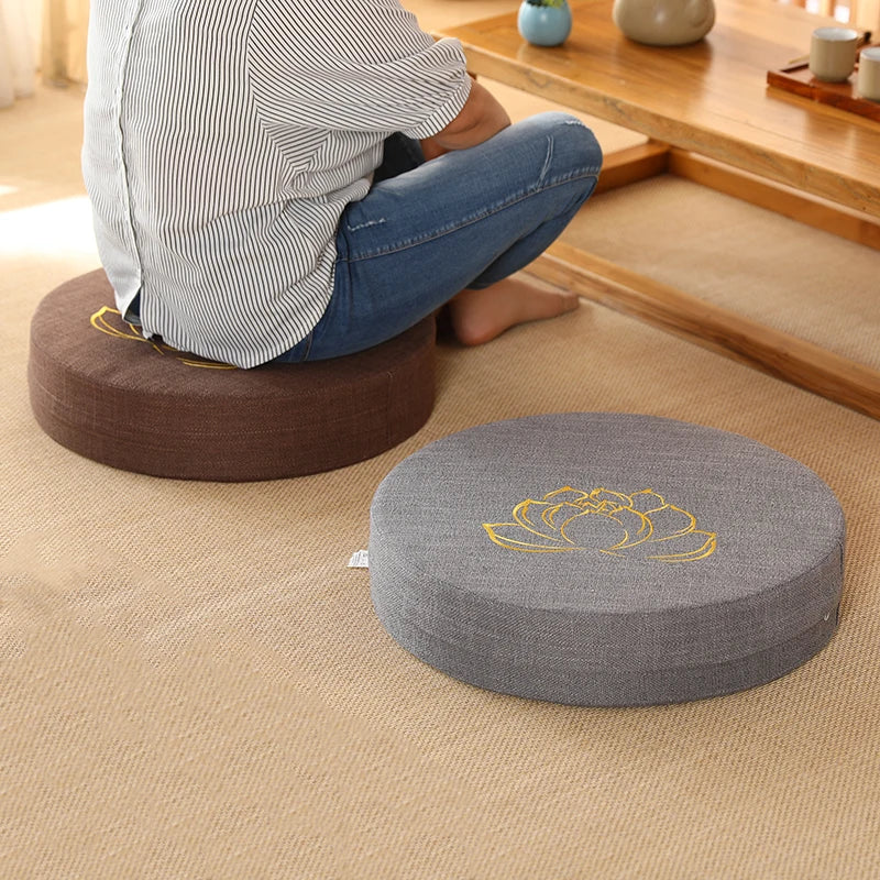 Image of the ZenBase Meditation Cushions in gray, brown, and red, each featuring a minimalist lotus design. These durable cushions provide firm support for meditation and yoga, combining Japanese-inspired tatami aesthetics with practicality. Compact, washable, and perfect for enhancing mindfulness practices.