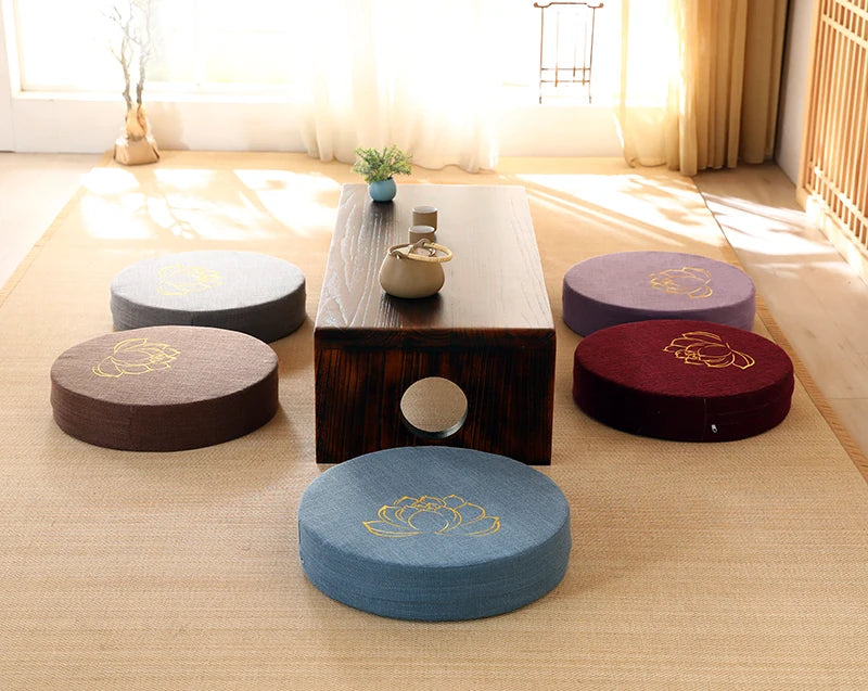 Image of the ZenBase Meditation Cushions in gray, brown, and red, each featuring a minimalist lotus design. These durable cushions provide firm support for meditation and yoga, combining Japanese-inspired tatami aesthetics with practicality. Compact, washable, and perfect for enhancing mindfulness practices.