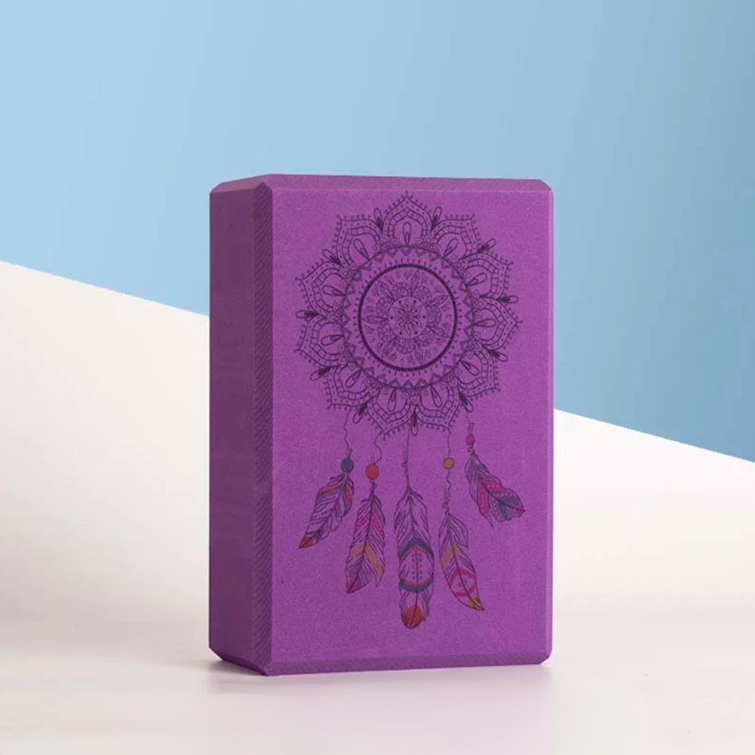 Image of the ZenBlock Yoga Block Set featuring high-density EVA foam in various colors, including purple, black, and white, with intricate designs like dreamcatchers and mandalas. Lightweight and durable, these blocks are perfect for providing support, balance, and stability during yoga, Pilates, and stretching exercises.